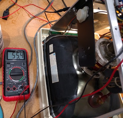 Testing the 55V power supply in the Xerox Alto's monitor.