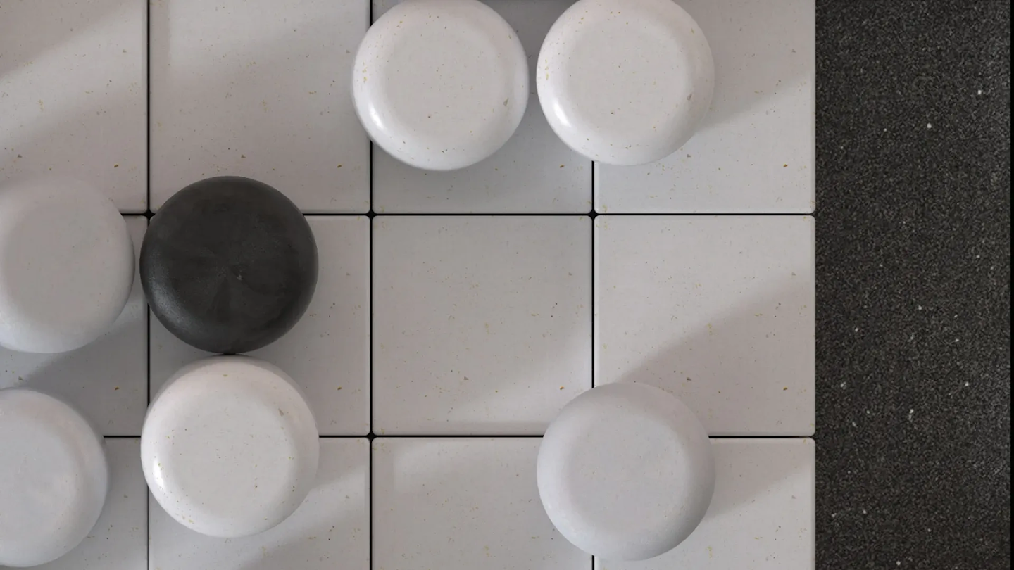 An overhead view of black and white stones on a Go board.